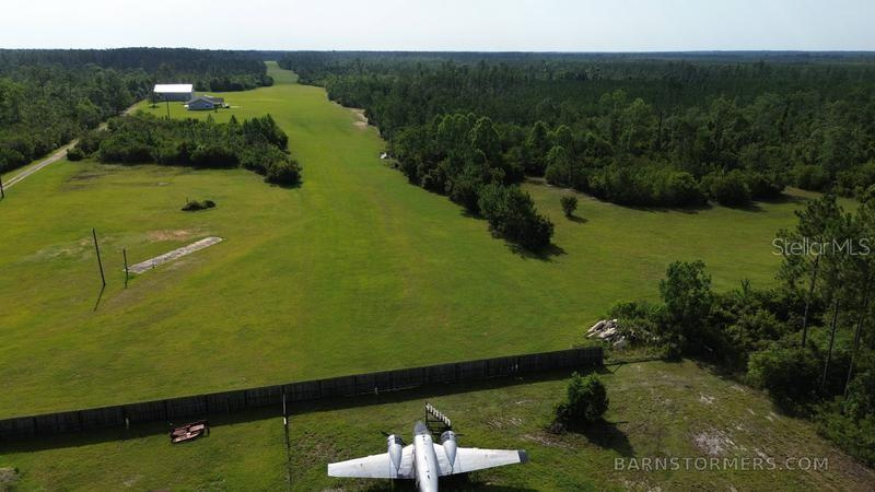Private Airport, New Hangar Building, House, and 80 Acres For Sale near Panama City, FL